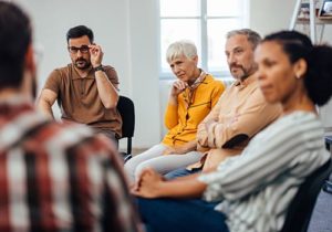 an addiction therapy program allows a diverse group to open up about their struggles and receive help and support in recovery