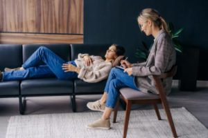 an individual therapy program as part of a full addiction treatment plan helps a woman open up and learn more about herself to benefit recovery 
