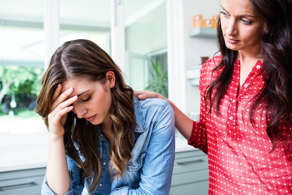 a woman is showing signs of heroin addiction and her friend thinks it is time to get help and enter treatment