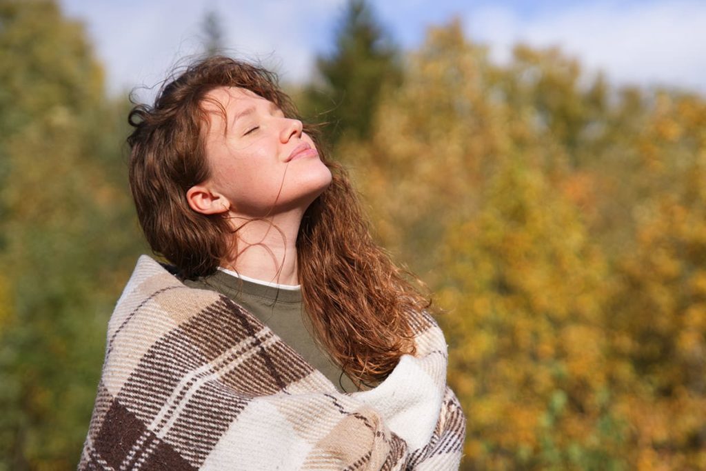 a young woman is proud of the work she has done to overcome self doubt