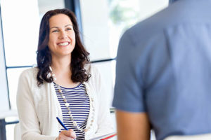 a motivational interviewing therapy specialist helps a man overcome his addiction 