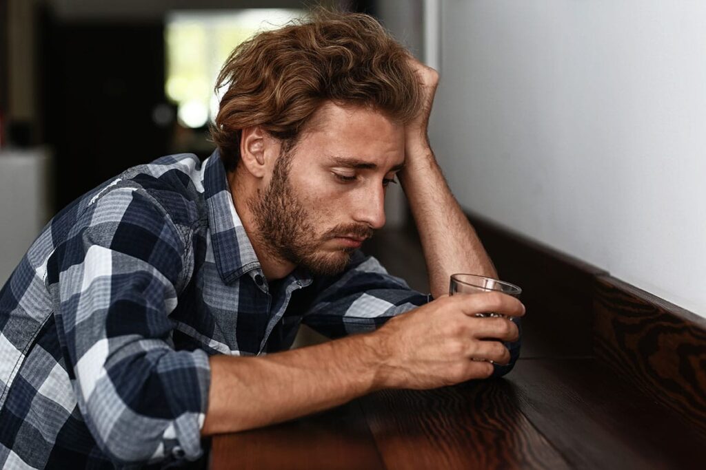 a young man worries if his excessive drinking habits make him a problem drinker
