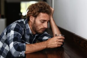a young man worries if his excessive drinking habits make him a problem drinker