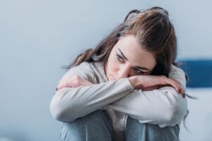 a young woman struggles to hide the signs of her prescription drug abuse