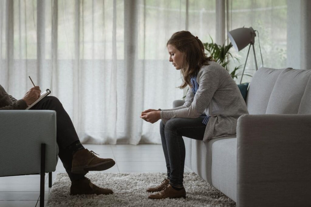 a woman opens up in therapy about her struggles with anxiety and addiction