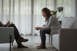 a woman opens up in therapy about her struggles with anxiety and addiction