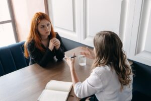 a woman opens up in therapy about her struggles with depression and alcoholism