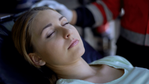 a woman begins to regain consciousness after an opioid overdose thanks to narcan