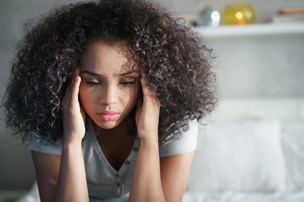 a woman struggles to manage the symptoms of her anxiety