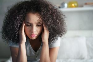 a woman struggles to manage the symptoms of her anxiety