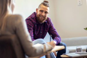 a man learns about medication assisted treatment options in rehab
