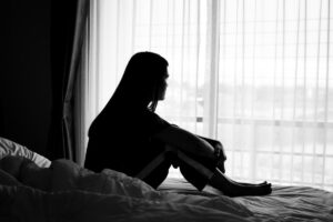 a woman struggles with self medicating